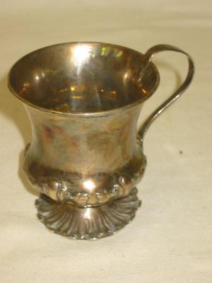 Appraisal: A WILLIAM IV MUG of compana form with scroll handle