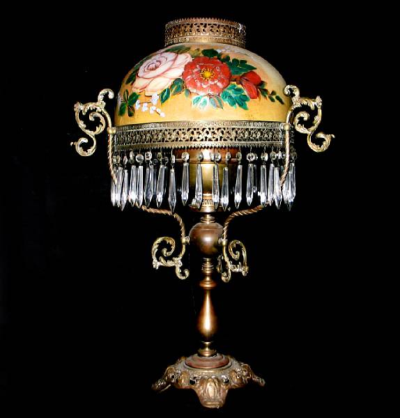 Appraisal: A Victorian gilt metal oil lamp with glass shade height