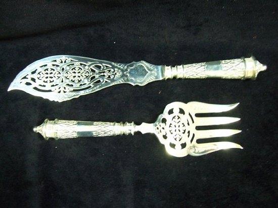 Appraisal: A pair of Victorian fish servers with Gothic tracery handles