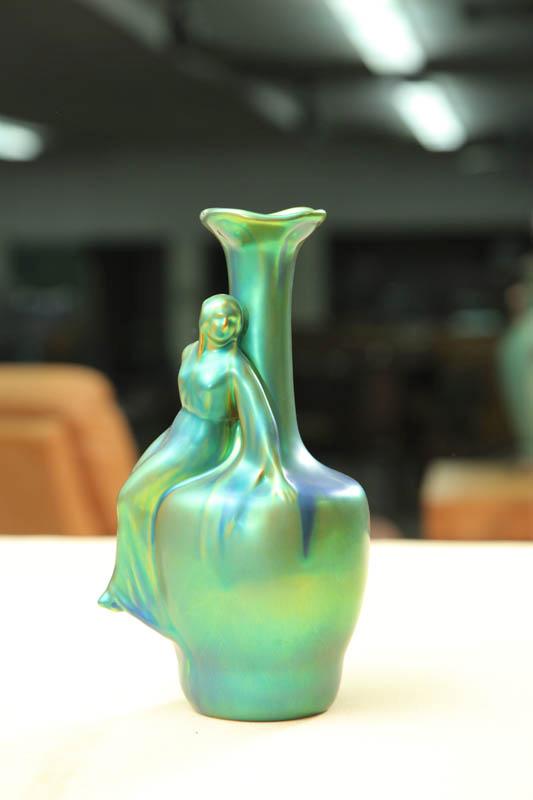 Appraisal: ZSOLNAY FIGURAL BOTTLE Green iridescent shouldered bottle with flared rim