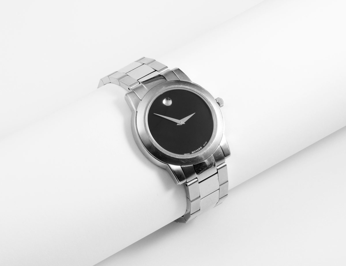 Appraisal: MOVADO STAINLESS STEEL WRISTWATCH Black dial with marker Integrated stainless