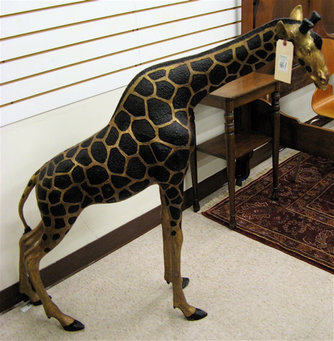 Appraisal: BRONZE WILDLIFE SCULPTURE the study of an African giraffe dark