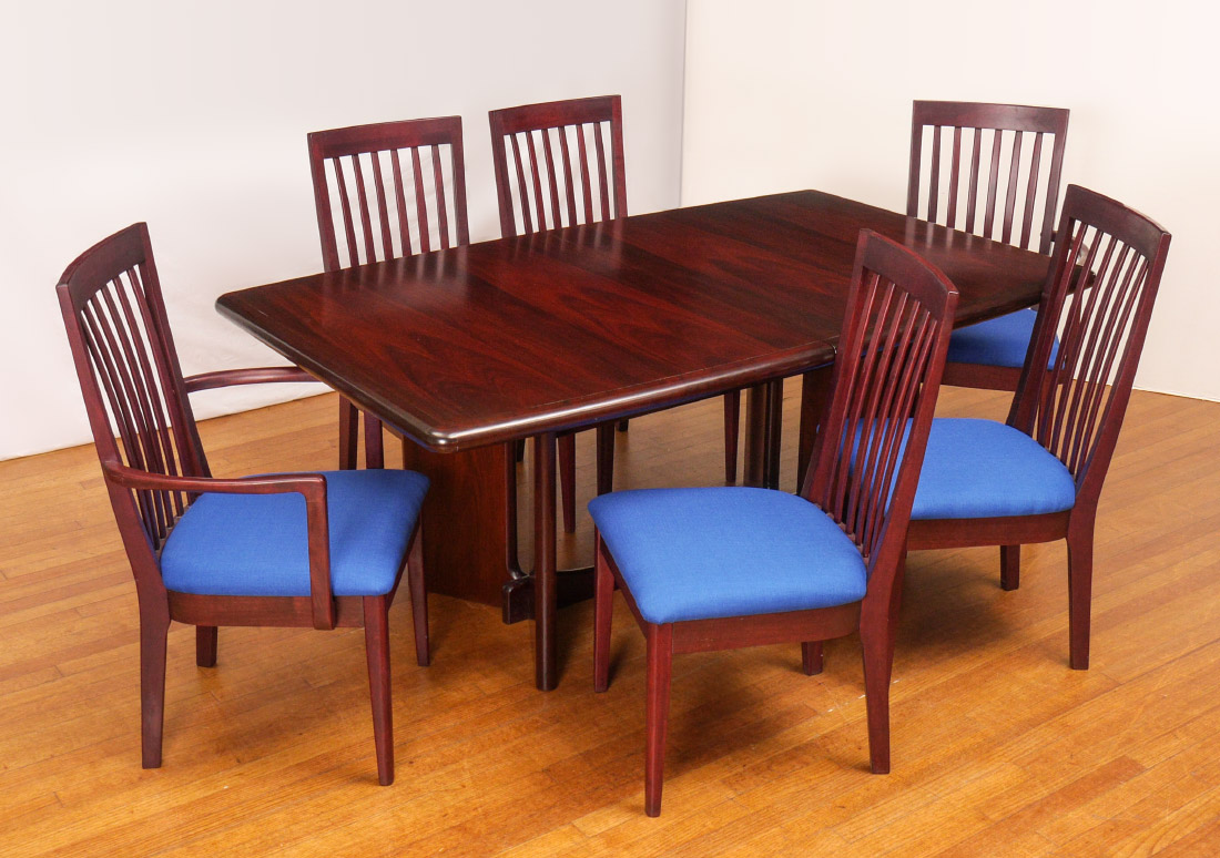 Appraisal: ANSAGER DANISH MODERN DINING TABLE CHAIRS Mahogany table with bowed