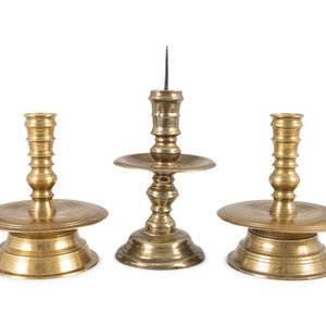 Appraisal: Three Continental Cast Brass Heemskirk Candlesticks Likely Dutch th Century