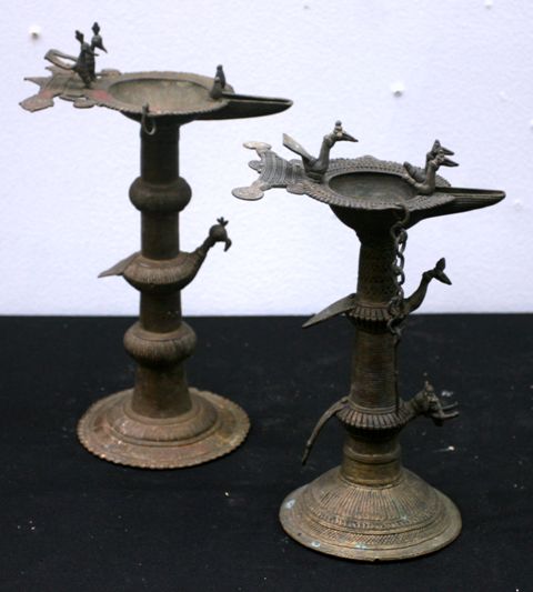 Appraisal: Two cast brass Dokra tribal oil lamps cast with bird