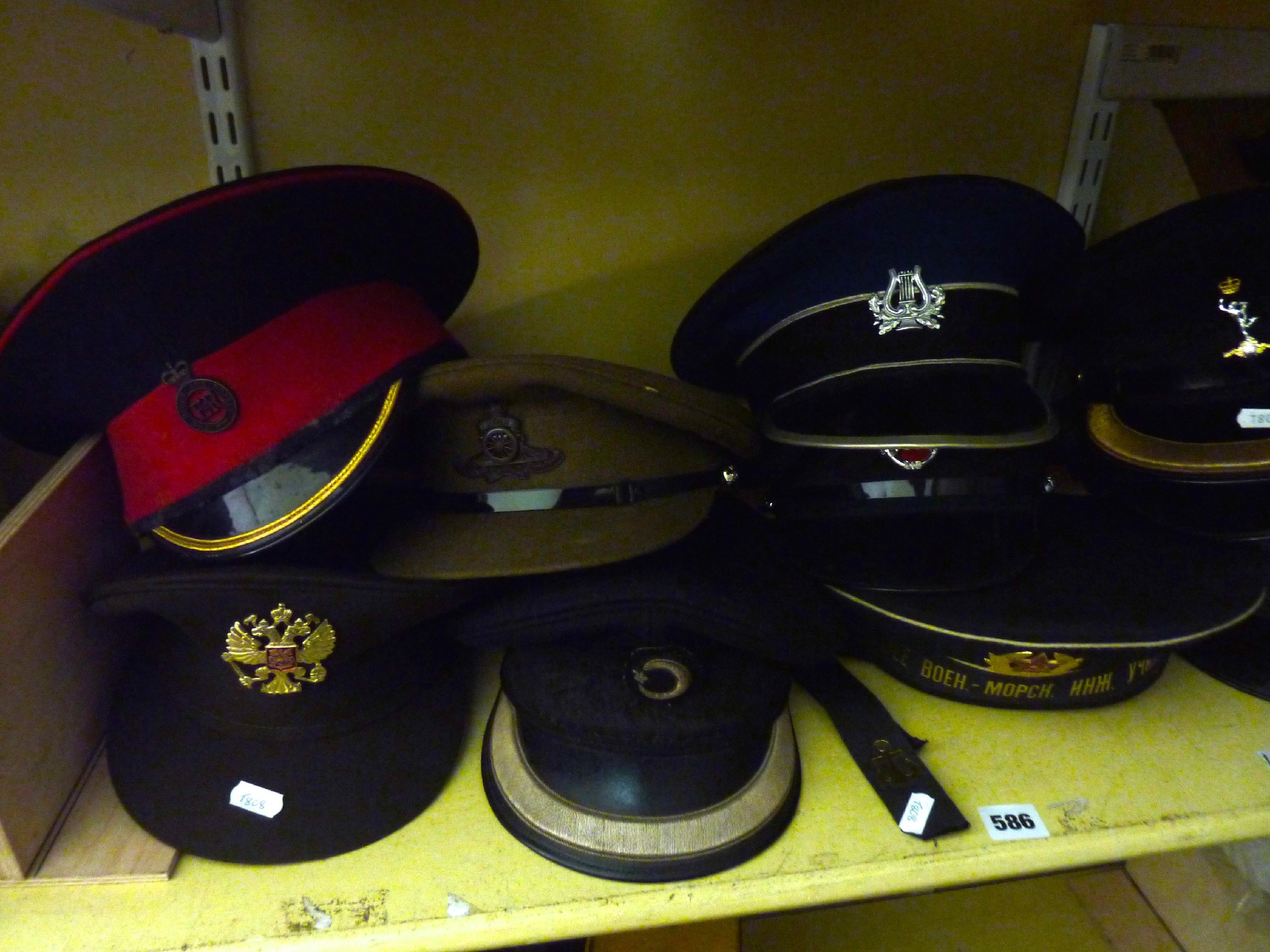 Appraisal: A collection of thirteen various military and naval caps from