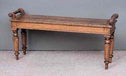 Appraisal: A Victorian oak rectangular hall bench the scroll ends with