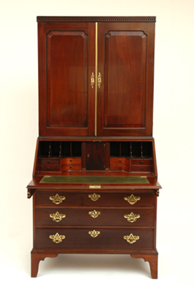 Appraisal: A GEORGE III MAHOGANY SECRETAIRE The blind fret carved cornice