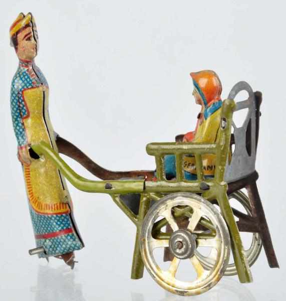 Appraisal: Tin Litho Woman Pushing Child Penny Toy German Marked Germany