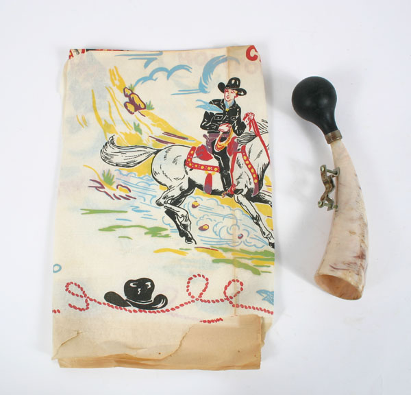 Appraisal: Hopalong Cassidy table cover and bicycle horn with raised Hopalong