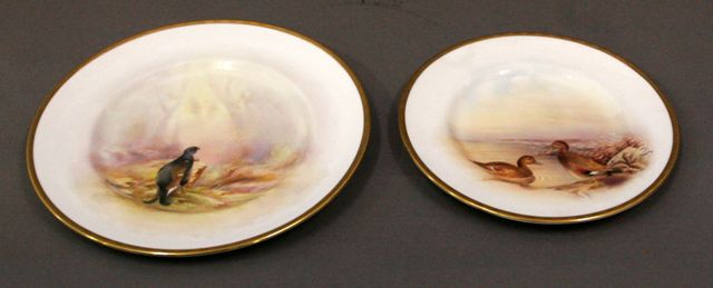 Appraisal: Two Royal Doulton cabinet plates the larger one painted with