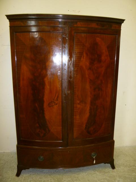 Appraisal: A MAHOGANY WARDROBE th century of bowed form with stringing