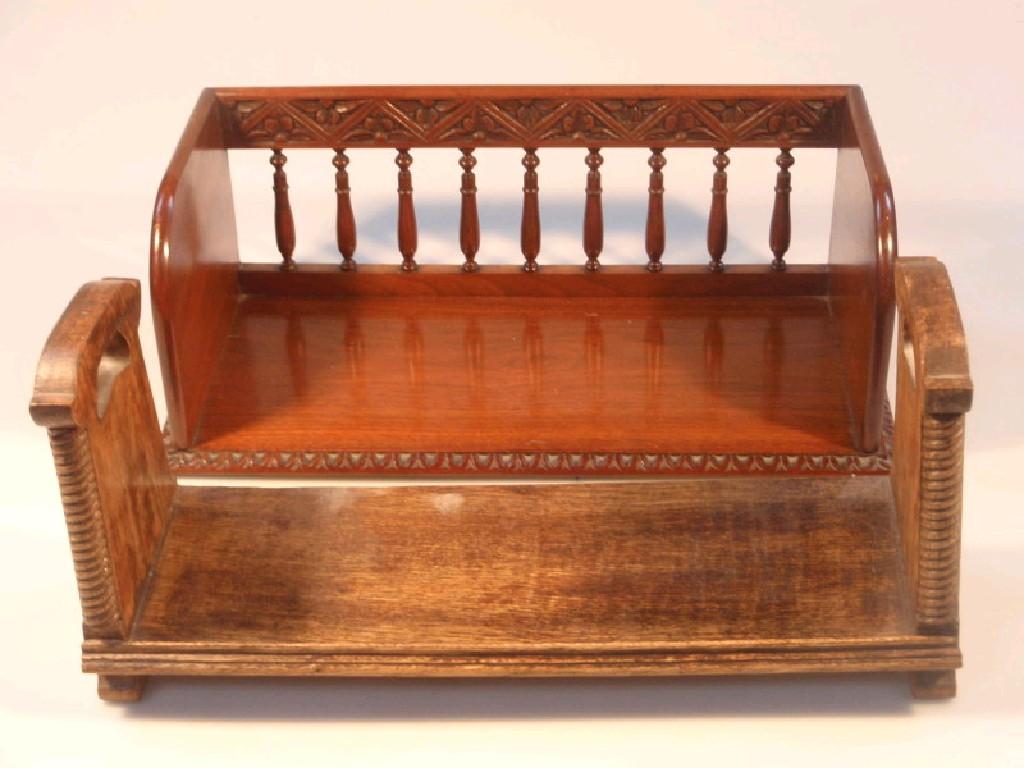 Appraisal: An oak book trough with galleried back and carved end