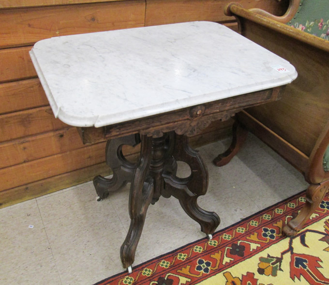 Appraisal: A VICTORIAN MARBLE-TOP WALNUT LAMP TABLE American last quarter of