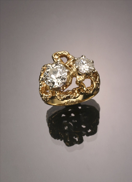 Appraisal: -Karat Yellow and White-Gold Twin-Diamond Dinner Ring The custom-made ring