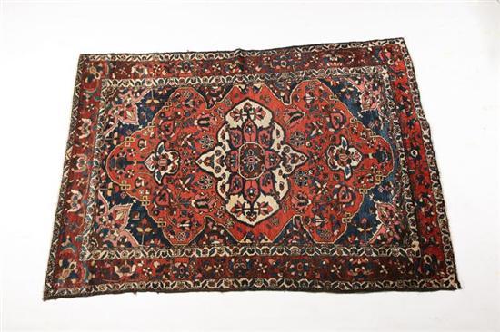 Appraisal: ORIENTAL RUG Bakhtiari Blue spandrels with red and blue ground