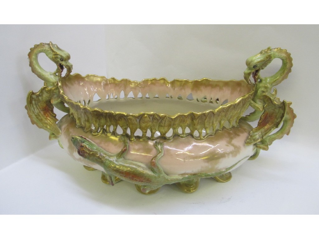 Appraisal: nautilus porcelain planter with dragon handles and lizard decoration