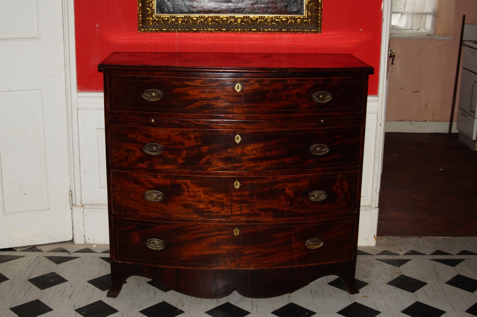 Appraisal: A George III mahogany bow front bachelor's chest of four