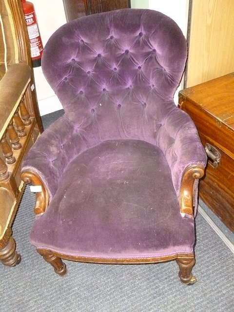 Appraisal: A TH CENTURY MAHOGANY LOW BUTTON BACK UPHOLSTERED ARMCHAIR with