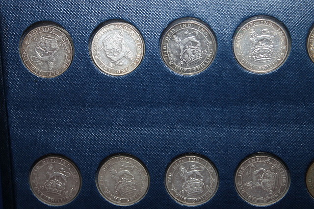 Appraisal: TWO ALBUMS OF COINS including shillings and sixpences in silver