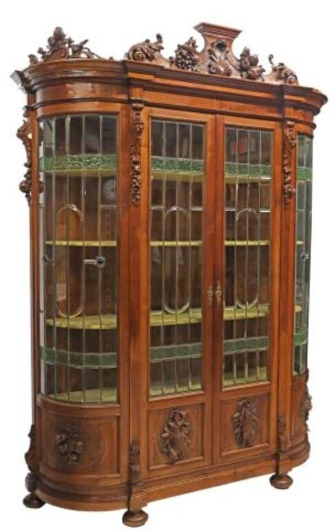 Appraisal: Renaissance Revival walnut bookcase display cabinet late th c carved