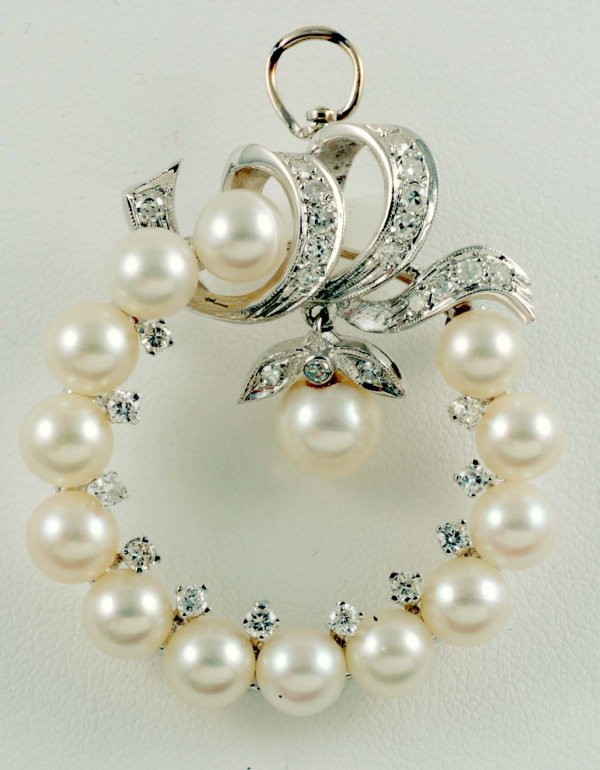 Appraisal: Pearl and diamond pendant brooch in approximately K white gold