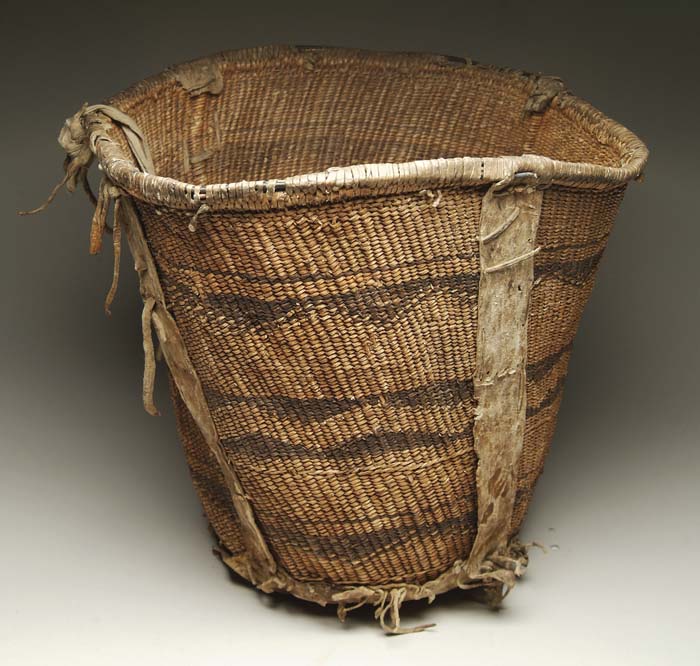 Appraisal: APACHE BURDEN BASKET Twined geometric stitching with a hide base