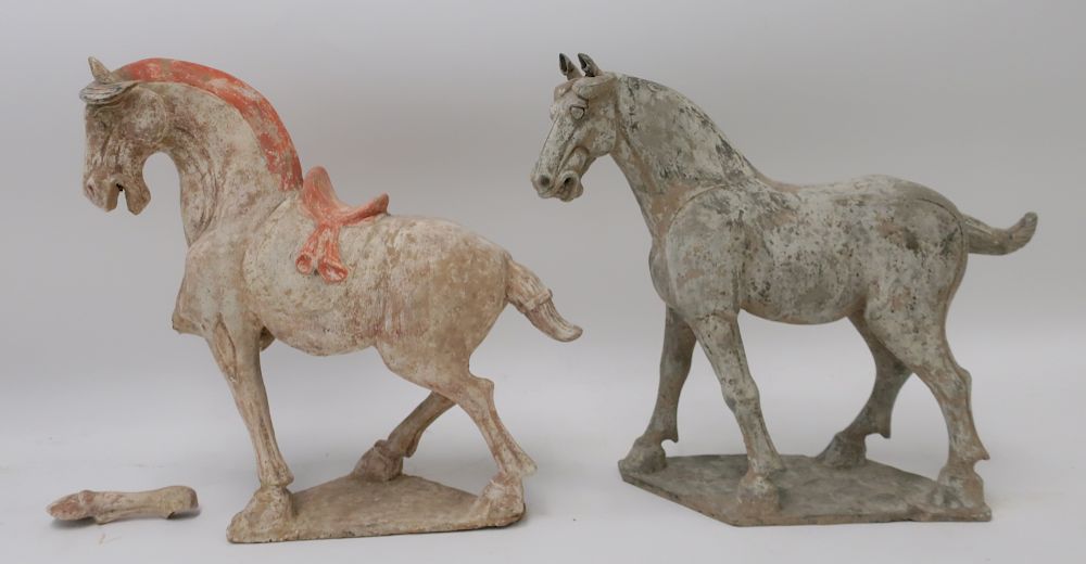 Appraisal: Two Large Tang Style Horses The large saddled horse well