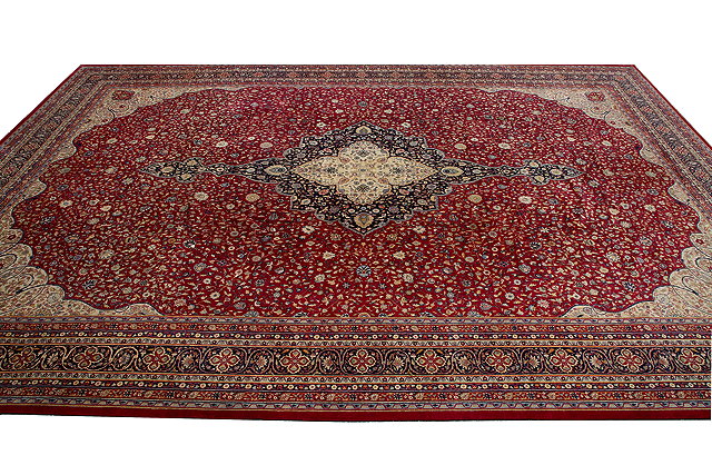 Appraisal: A LARGE OLD ORIENTAL RED GROUND RUG with central cream