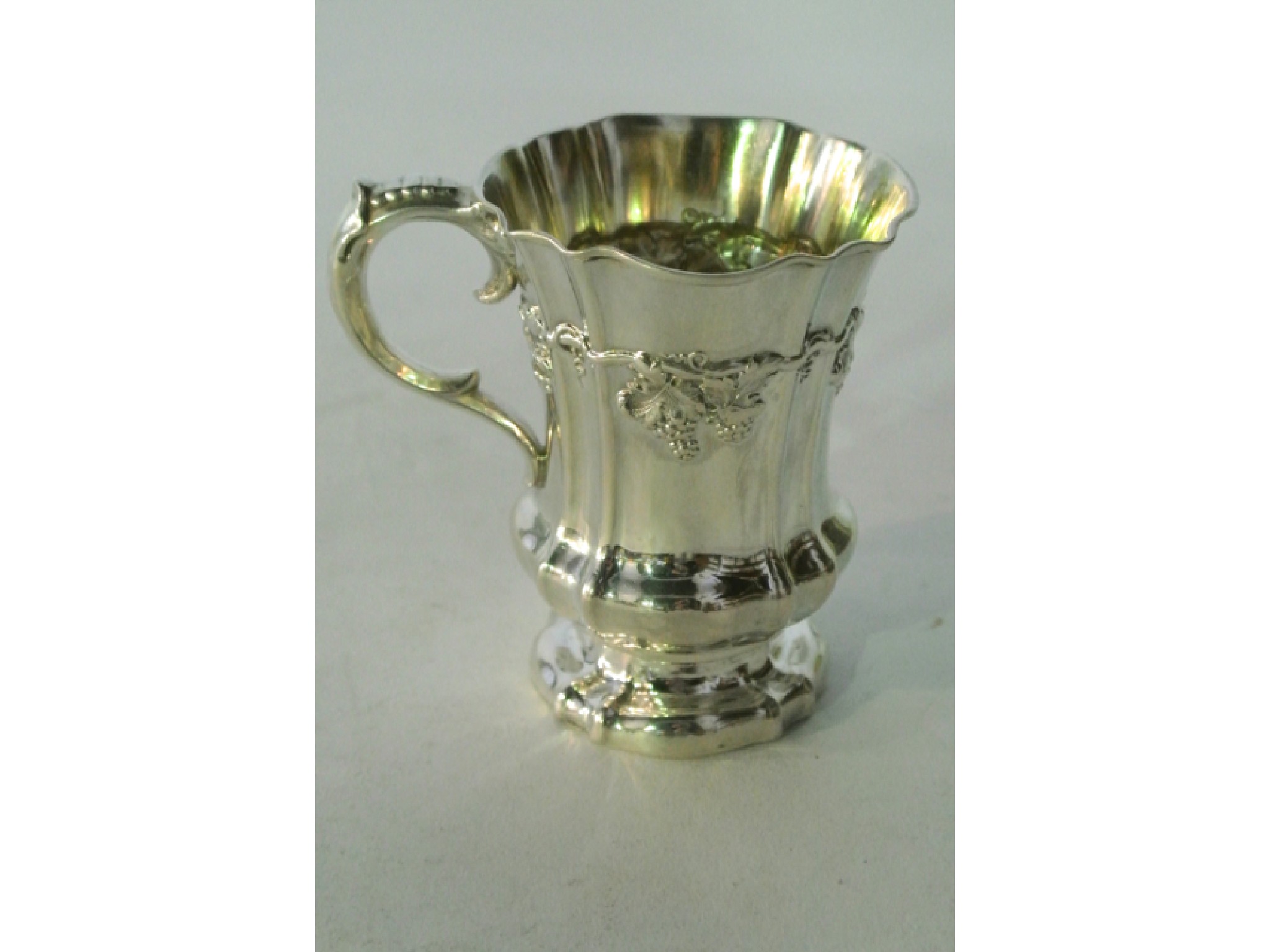 Appraisal: A white metal Christening cup stamped M the baluster semi-fluted