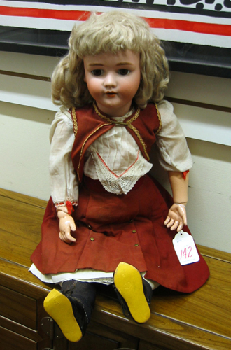 Appraisal: A GERMAN HEINRICH HANDWERCK GIRL DOLL in human hair blond