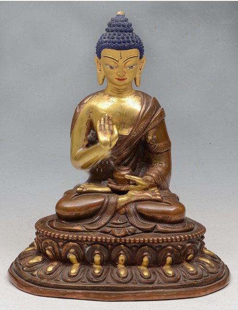 Appraisal: A SINO TIBETAN FIGURE OF BUDDHA seated upon a double