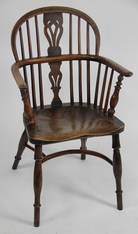 Appraisal: A Windsor type chair with yew wood arms and splats