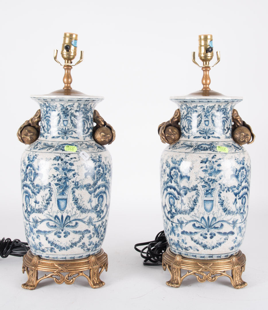 Appraisal: Pair of oriental style gilt-metal-mounted lamps with shades