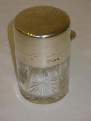 Appraisal: A GLASS TOILET JAR of cylindrical form the hinged lid