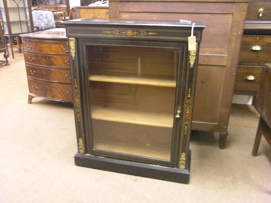 Appraisal: A Victorian ebonised display cabinet with box-wood marquetry to the