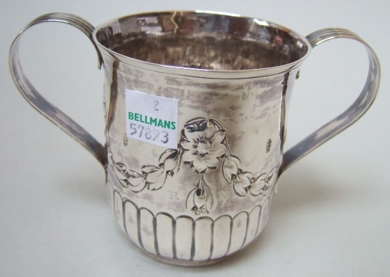 Appraisal: A George III silver twin handled cup the body decorated