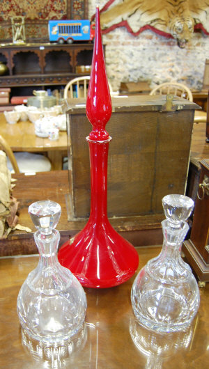 Appraisal: An Opalina red decanter and long stopper cm h to