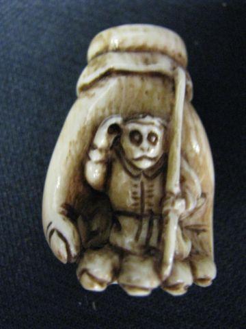 Appraisal: Carved Ivory Netsuke of a Giant Hand man inside signed