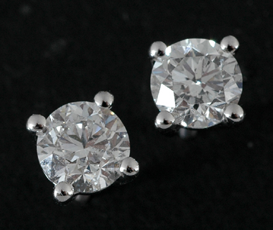 Appraisal: A pair of diamond stud earrings Each set with a