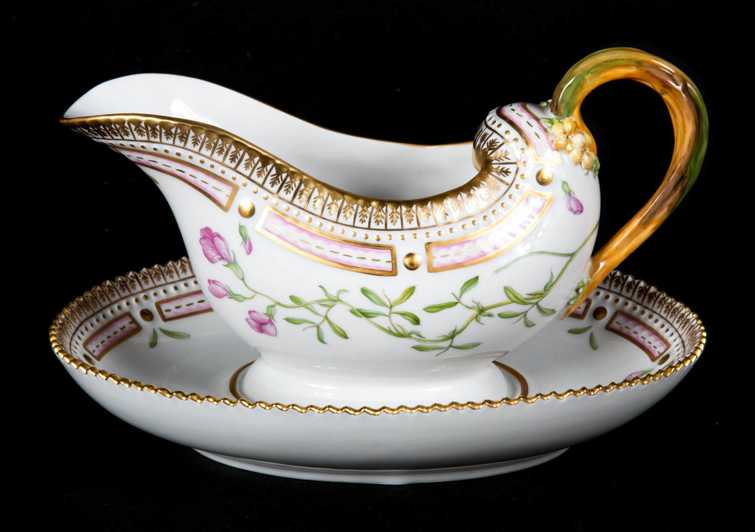 Appraisal: Royal Copenhagen Flora Danica gravy boat gravy boat with attached