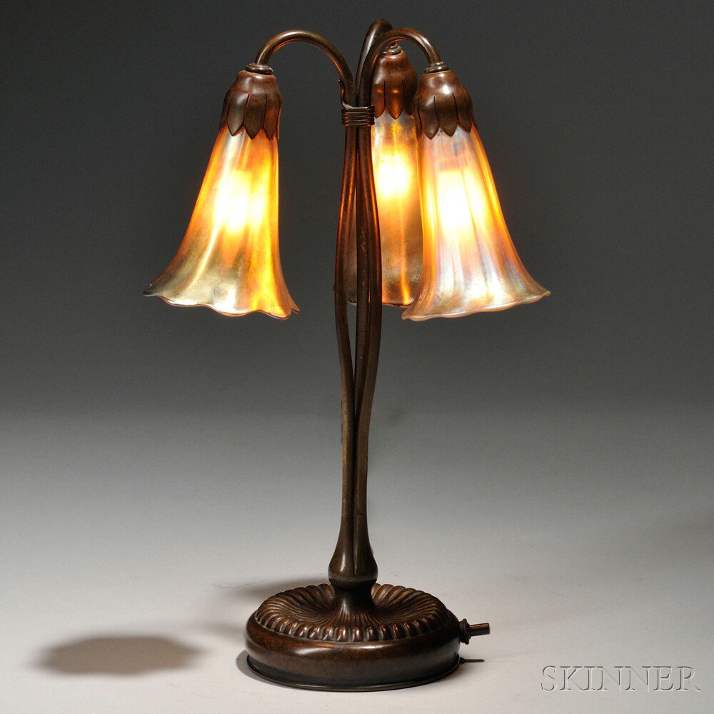 Appraisal: Tiffany Studios Three-light Lily Lamp Patinated bronze favrile glass New