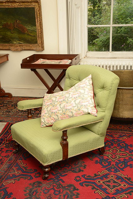 Appraisal: A TH CENTURY MAHOGANY ARMCHAIR with buttoned back with green