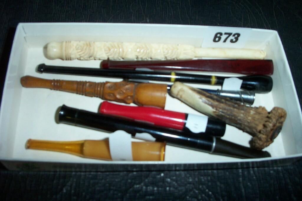 Appraisal: A collection of nine old cigarette holders in ivory antler