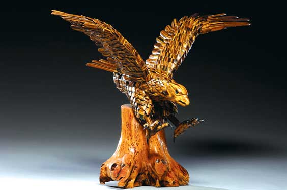 Appraisal: CARVED SECTIONAL TIGER'S EYE EAGLE Chinese sectional tigereye model of