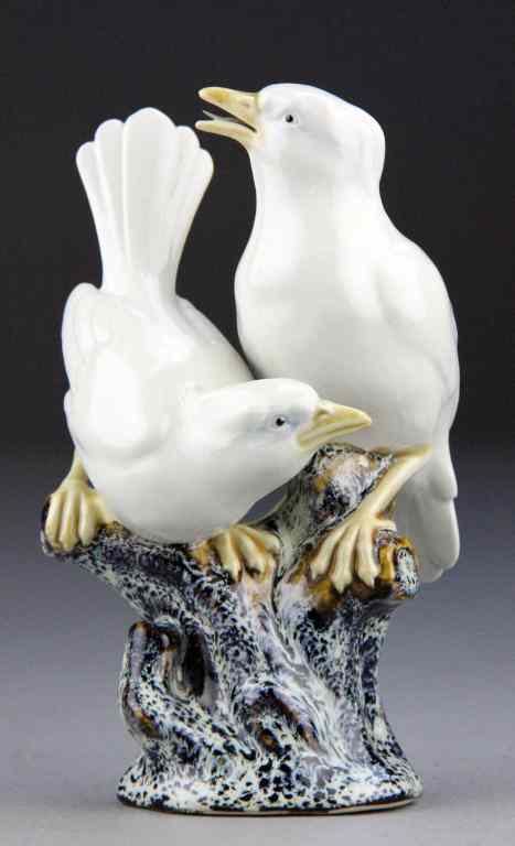 Appraisal: Chinese Glazed Porcelain Bird GroupDepicting two white yellow-beaked birds perched