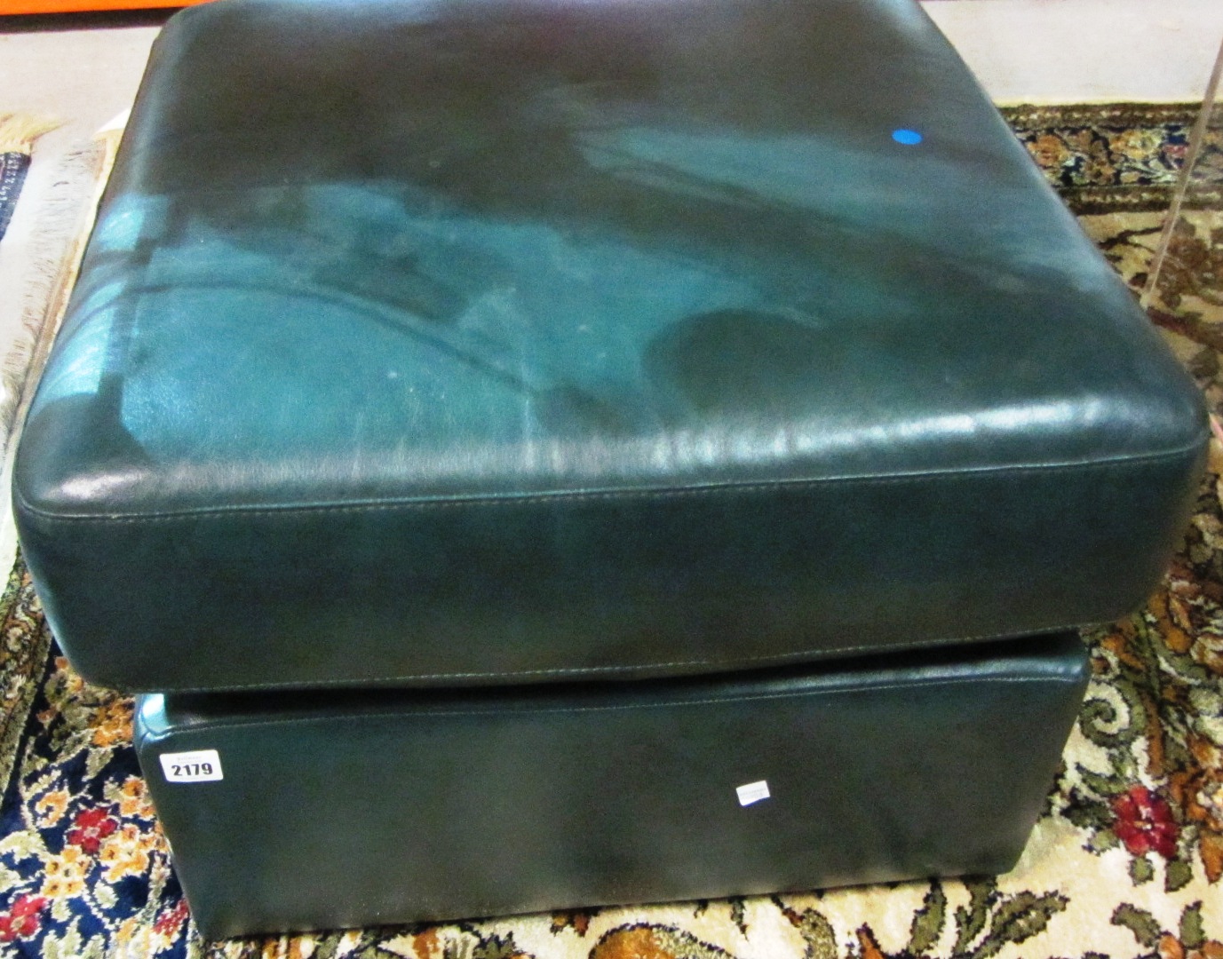 Appraisal: A th century green leather footstool