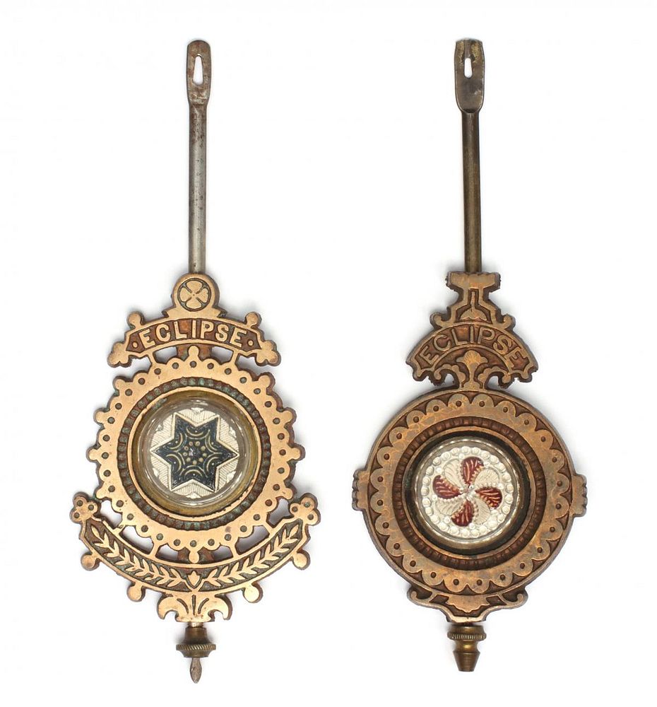 Appraisal: E N WELCH FANCY BRASS PENDULUMS WITH SANDWICH GLASS The