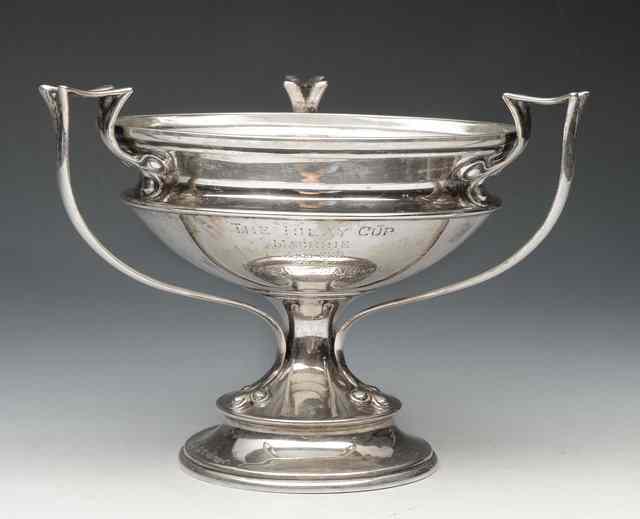 Appraisal: A SILVER THREE HANDLED TROPHY CUP on turned stepped foot