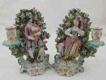 Appraisal: A pair of Derby ceramic shepherd and shepherdess candlesticks the